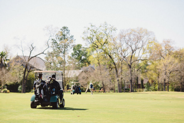 Wedding party playing golf at Champions Golf Club